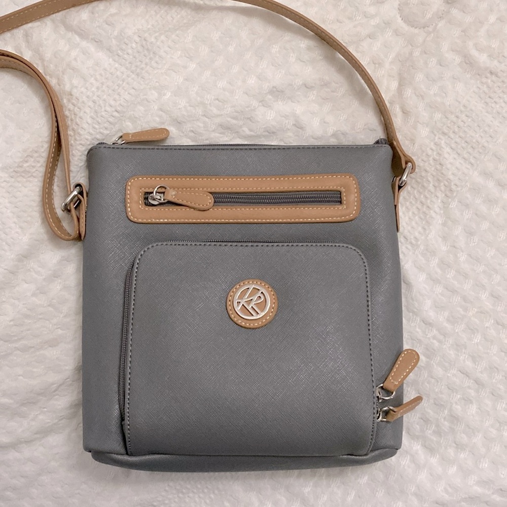 This is a nice leather bag that is brand new. The brand is  Kim Rogers.